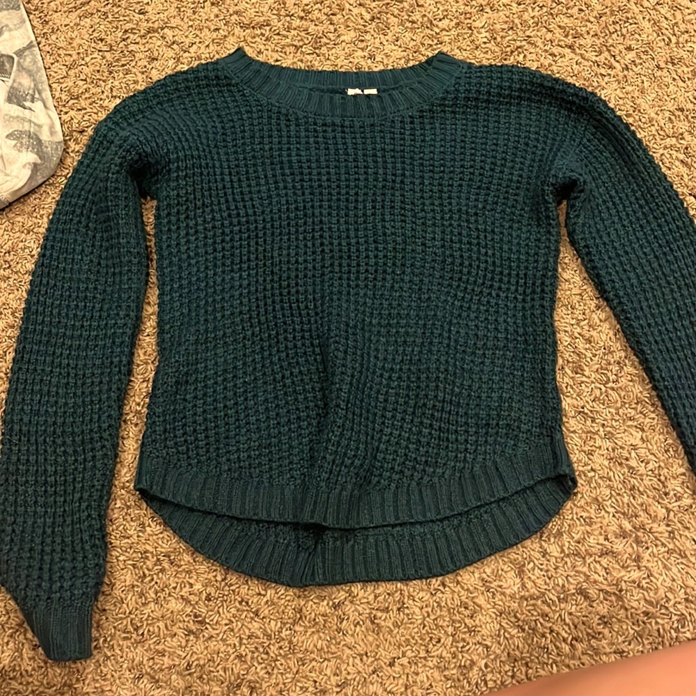 a navy sweater with a soft inside